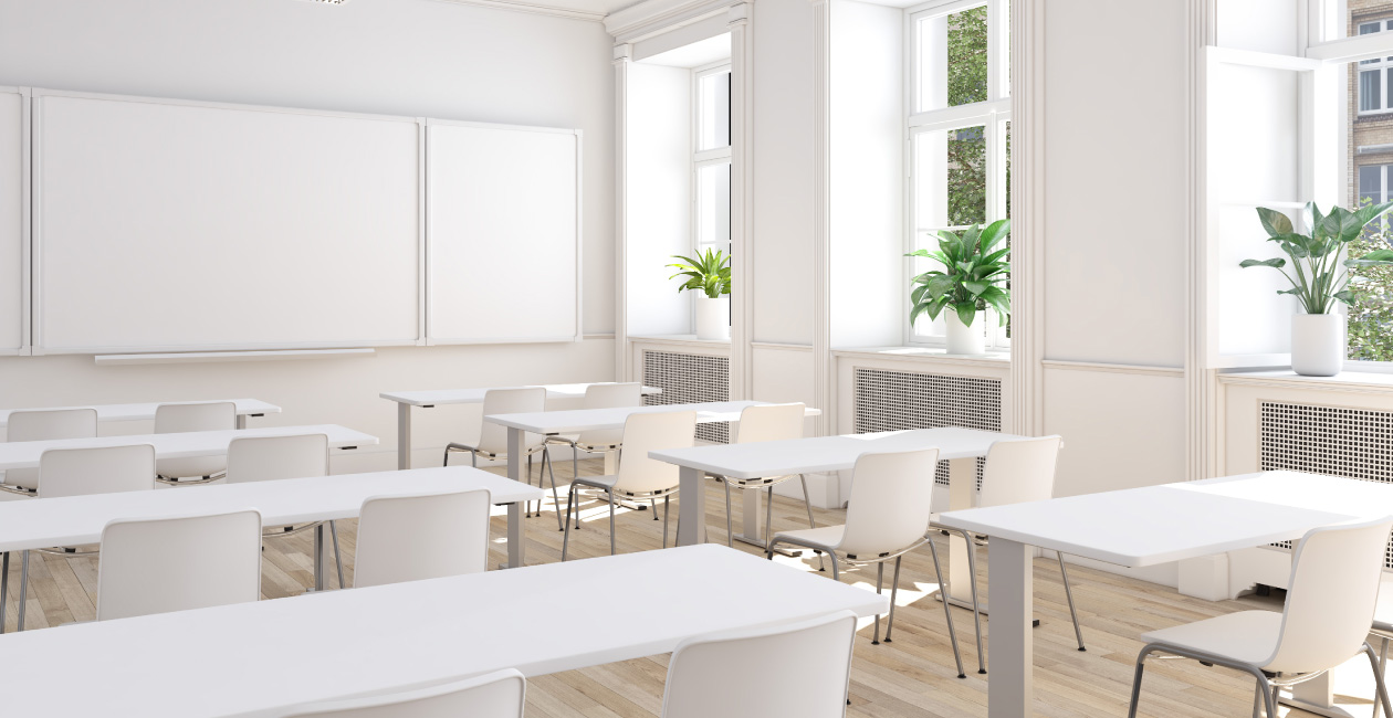 An all white classroom with white tables and white chairs
